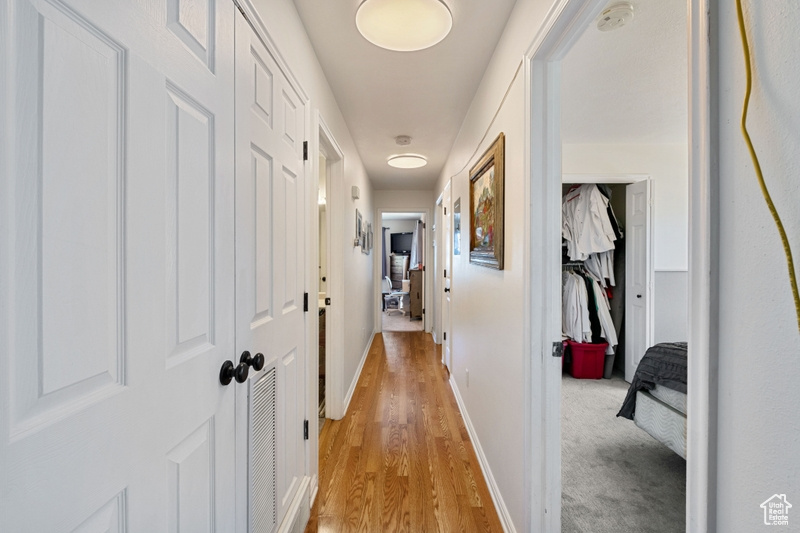 Hall featuring light hardwood / wood-style flooring