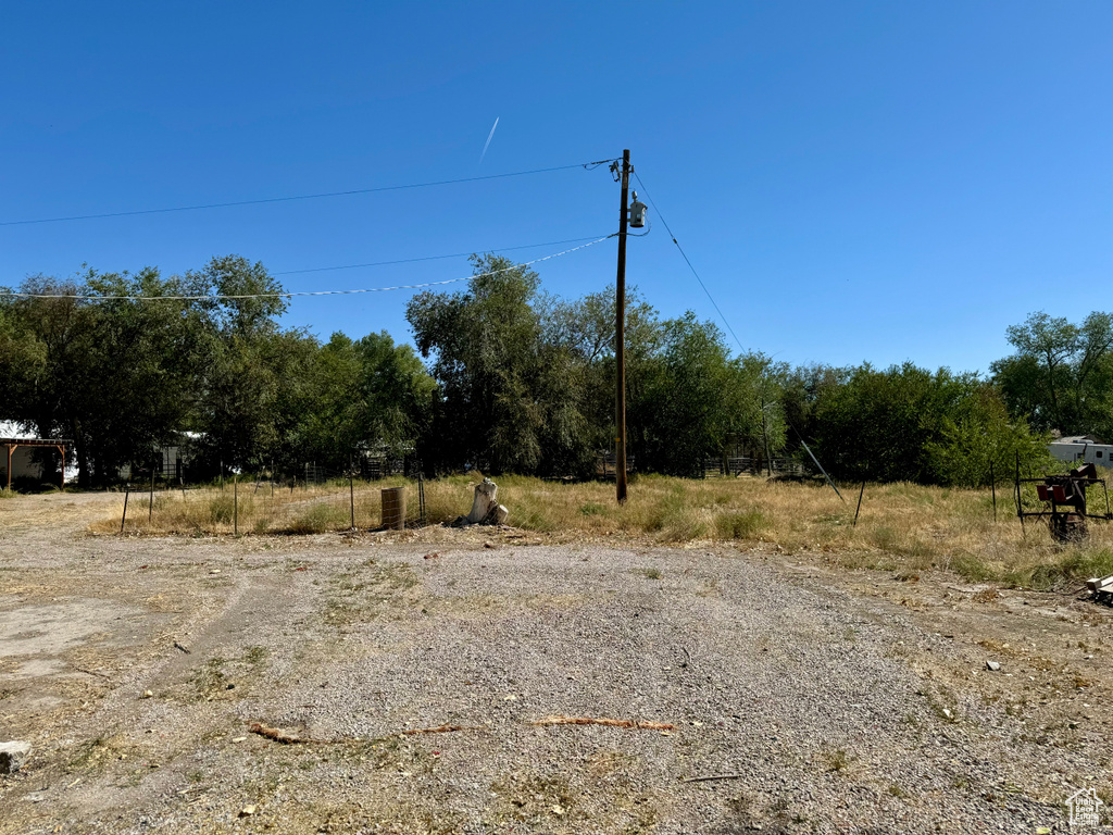 View of yard with a rural view