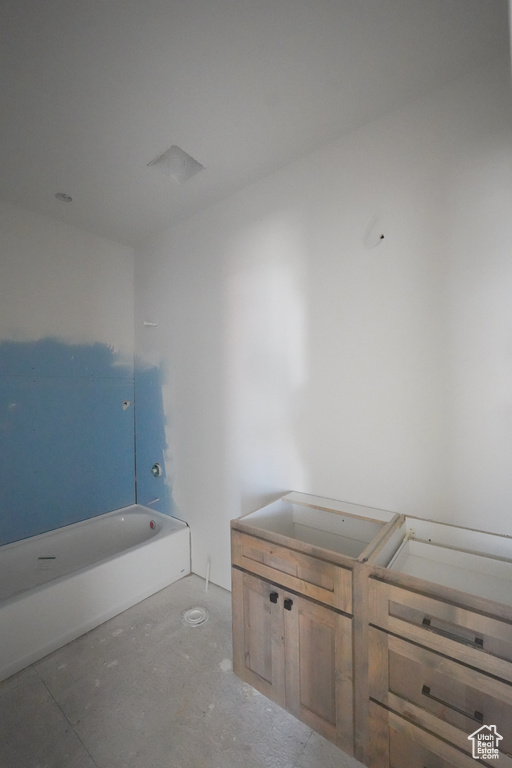 Bathroom with concrete flooring