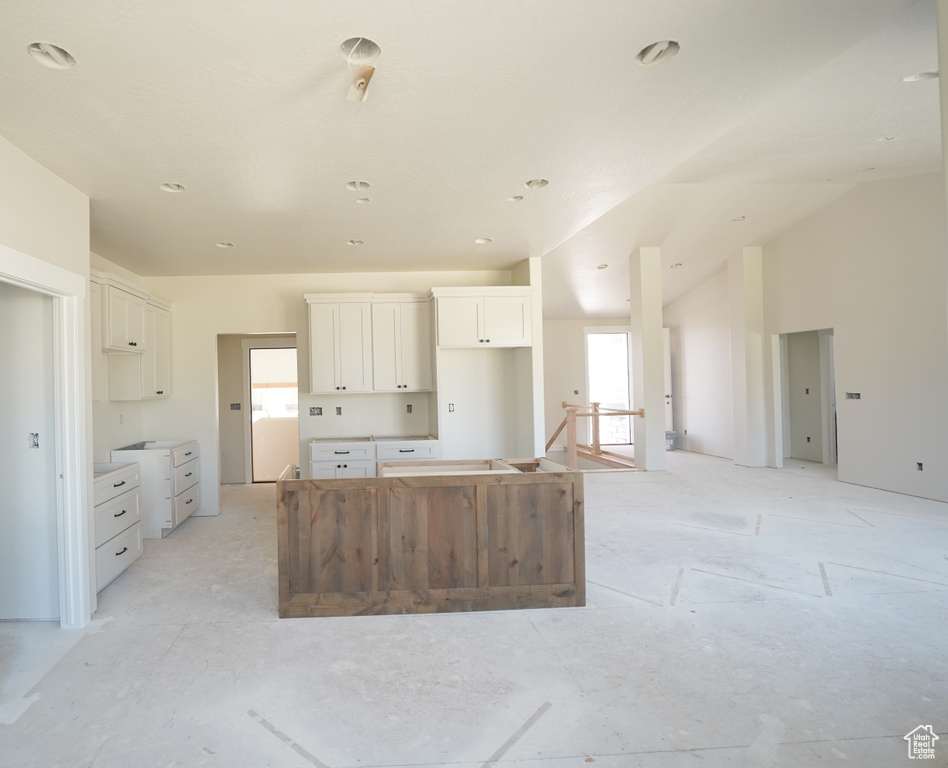 Kitchen with white cabinets and a center island