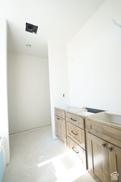 Bathroom with concrete flooring and vanity