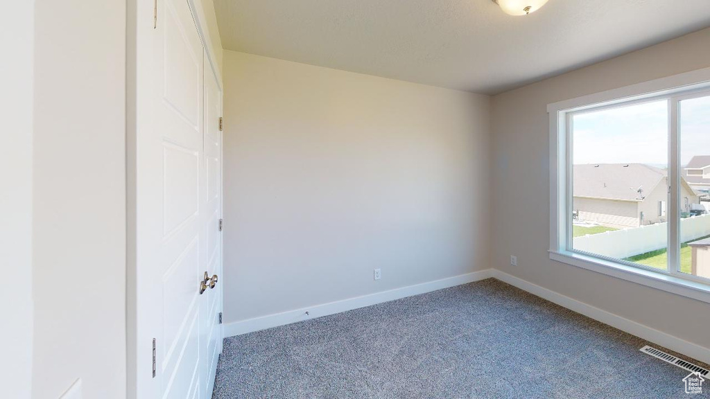 Empty room with carpet flooring