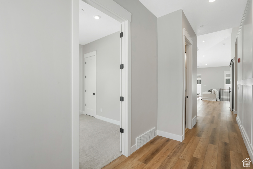 Hall featuring light wood-type flooring