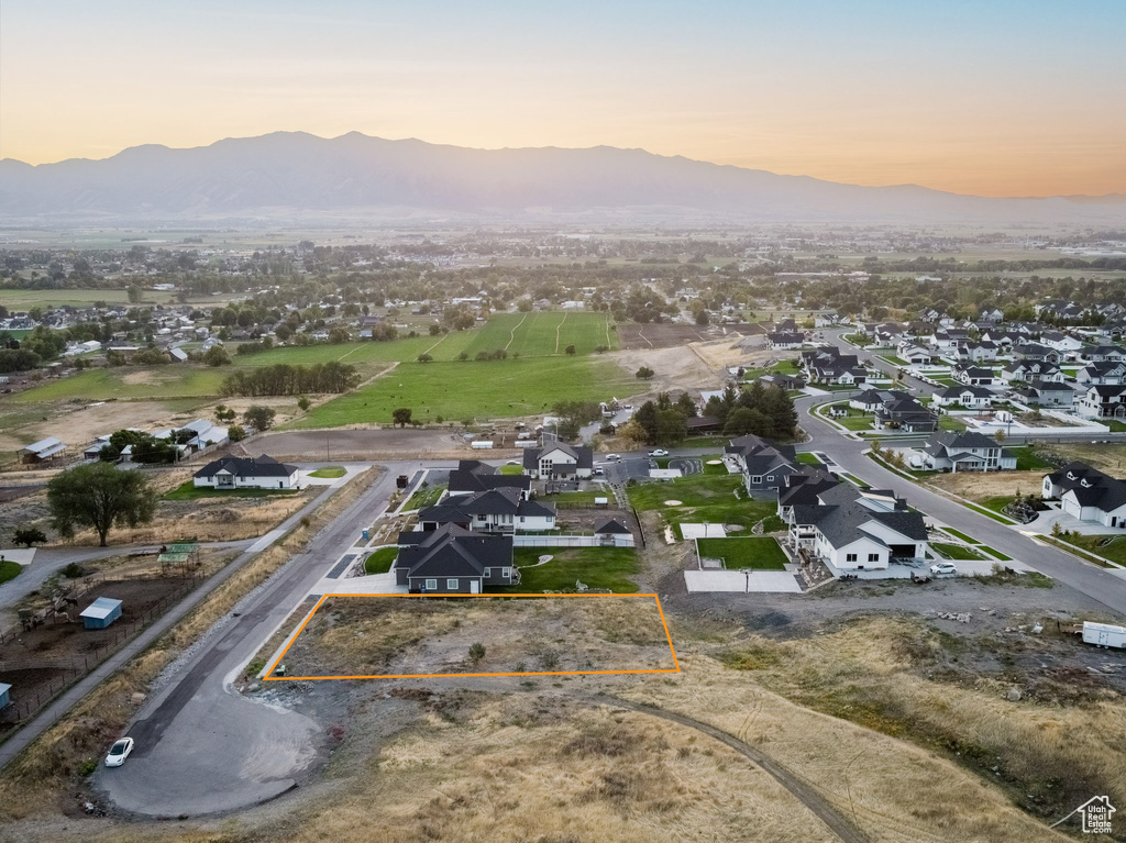 Aerial view at dusk featuring a mountain view