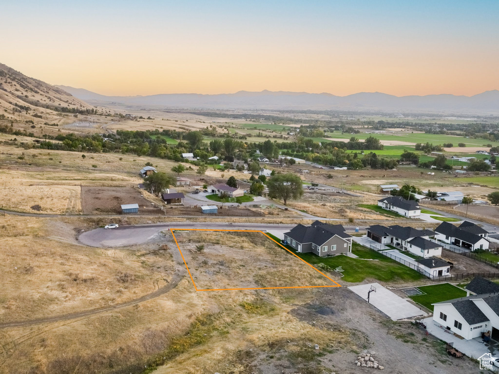 Aerial view at dusk featuring a mountain view