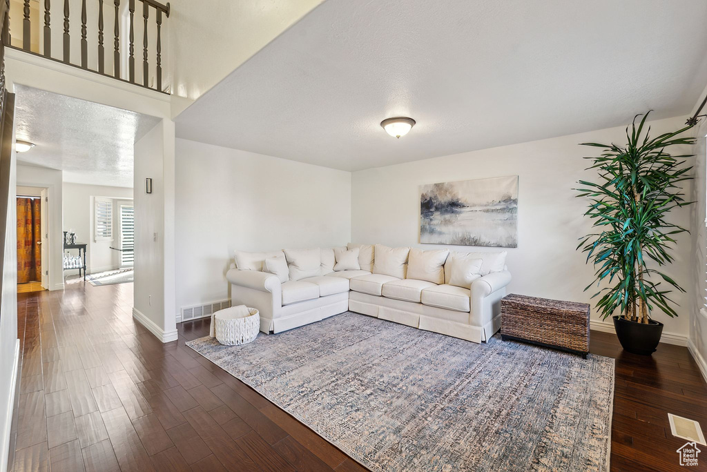 Living room featuring dark hardwood / wood-style flooring