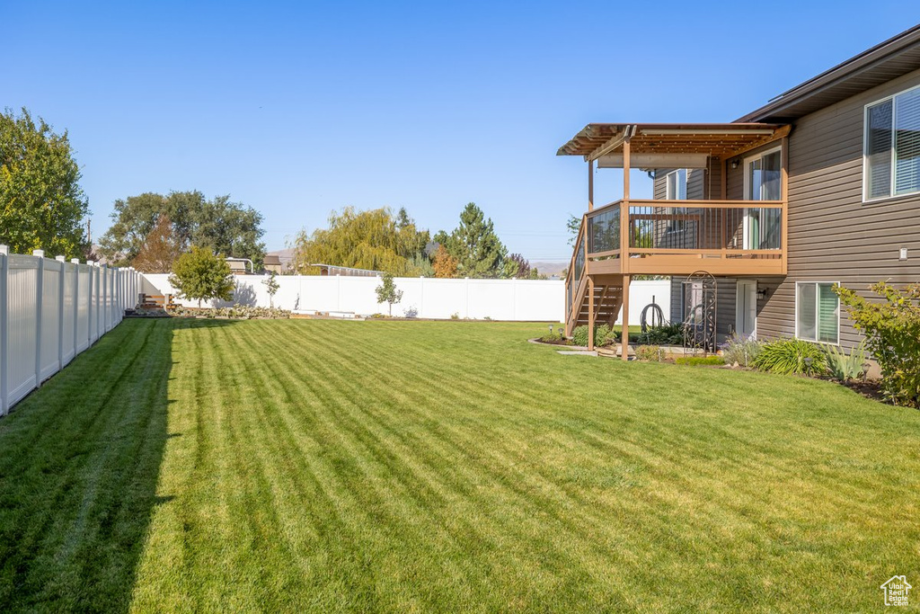 View of yard featuring a wooden deck