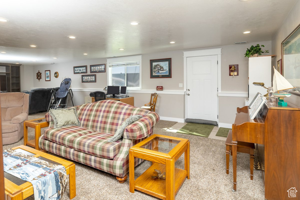 Living room featuring light carpet