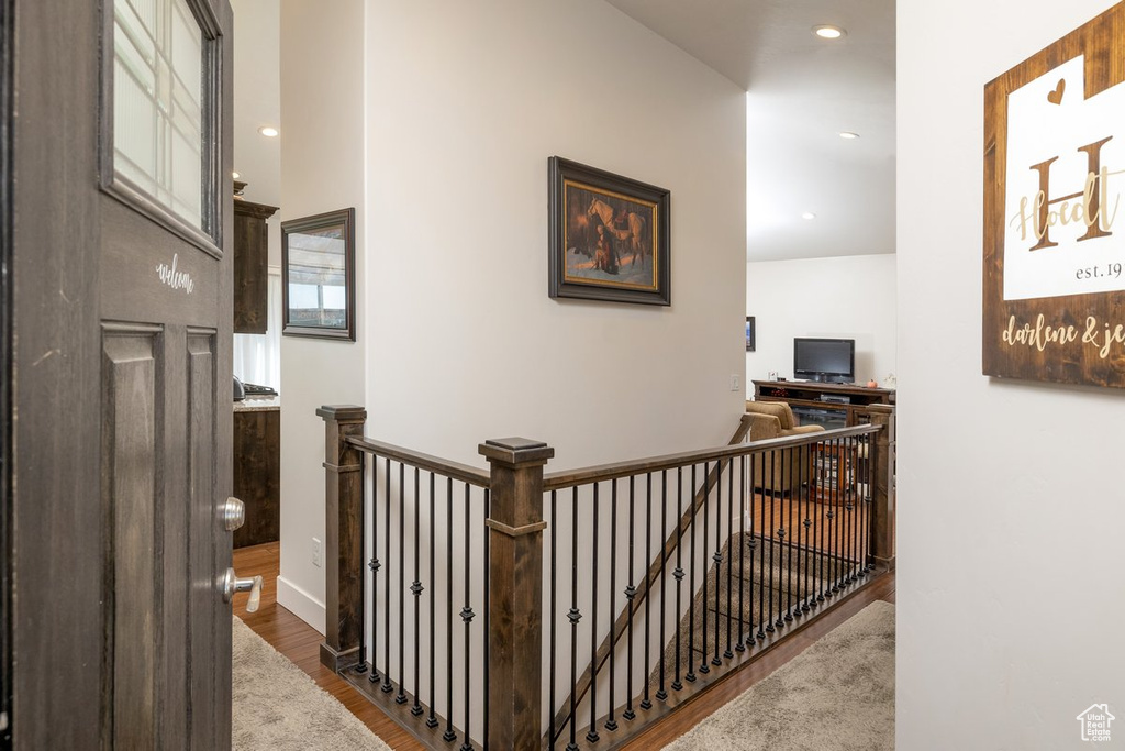 Hallway featuring dark wood-type flooring