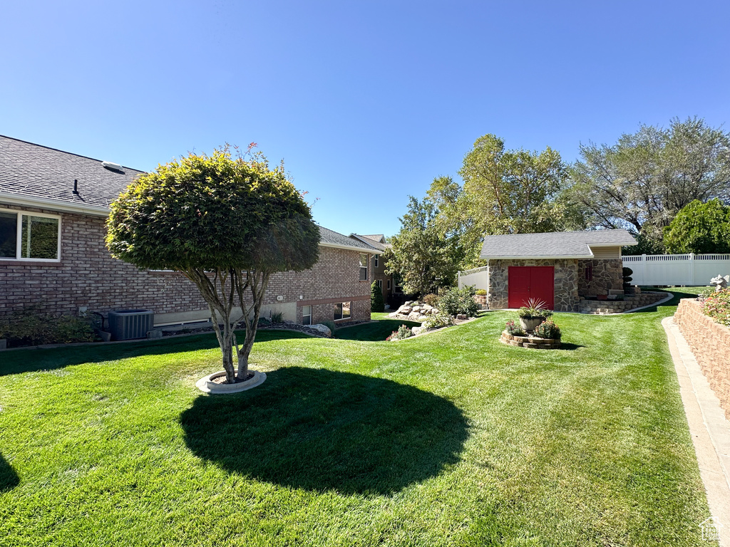 View of yard featuring central AC