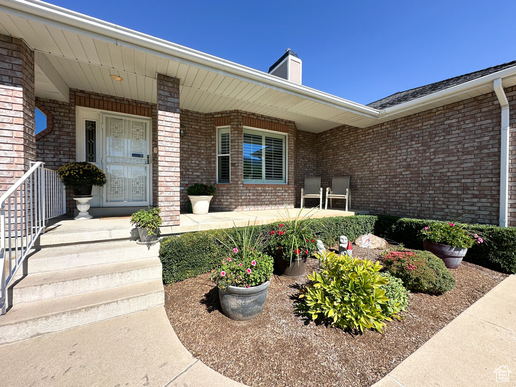 Property entrance with covered porch