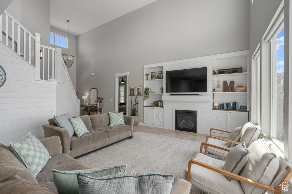 Living room with wooden walls and a towering ceiling