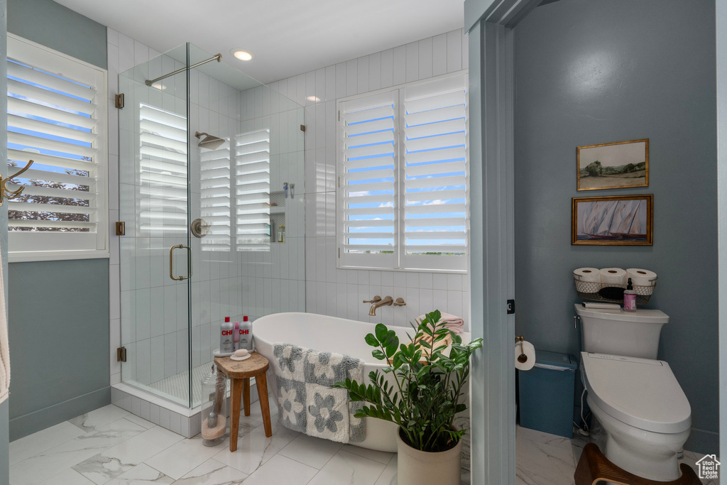 Bathroom with toilet and separate shower and tub