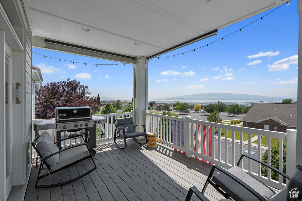 Wooden terrace with a mountain view and grilling area