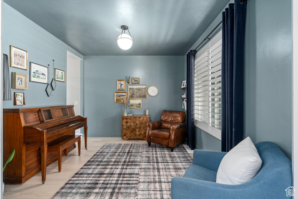 Sitting room featuring hardwood / wood-style floors