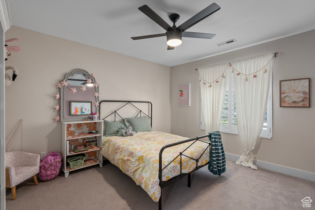 Bedroom with carpet and ceiling fan