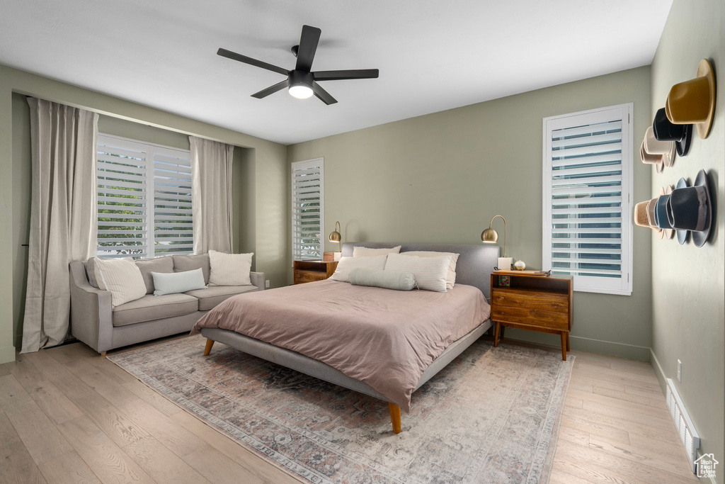 Bedroom with light wood-type flooring and ceiling fan