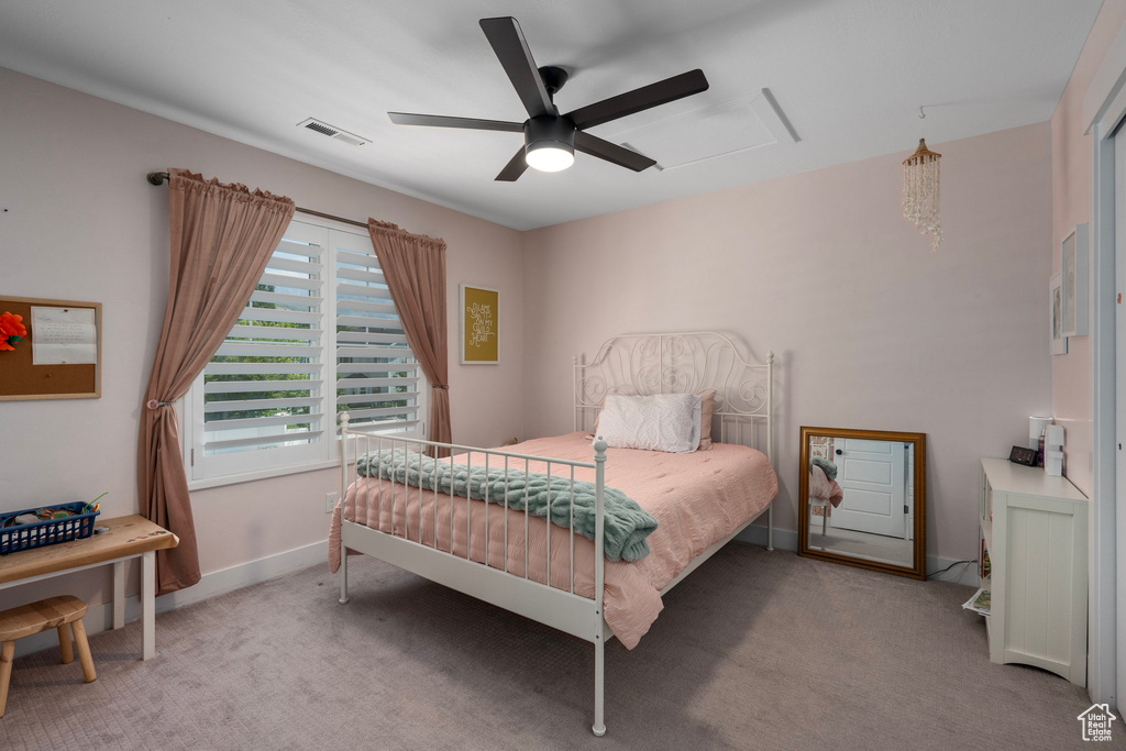 Bedroom featuring ceiling fan and light colored carpet