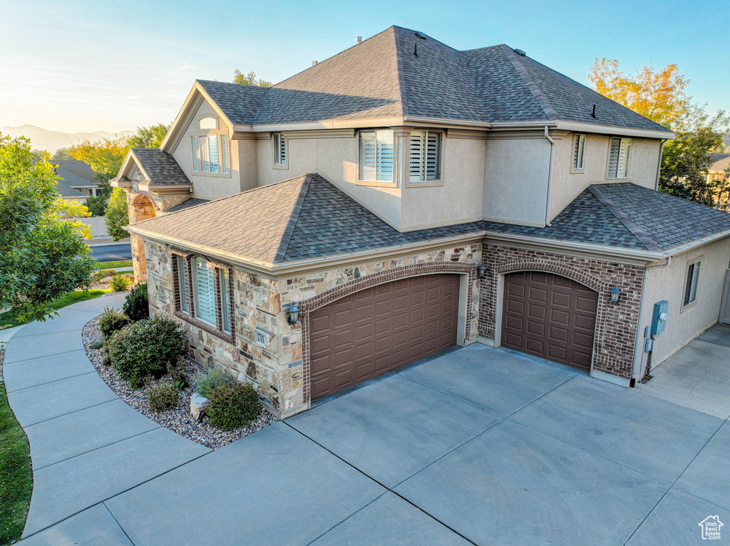 View of front of home featuring a garage