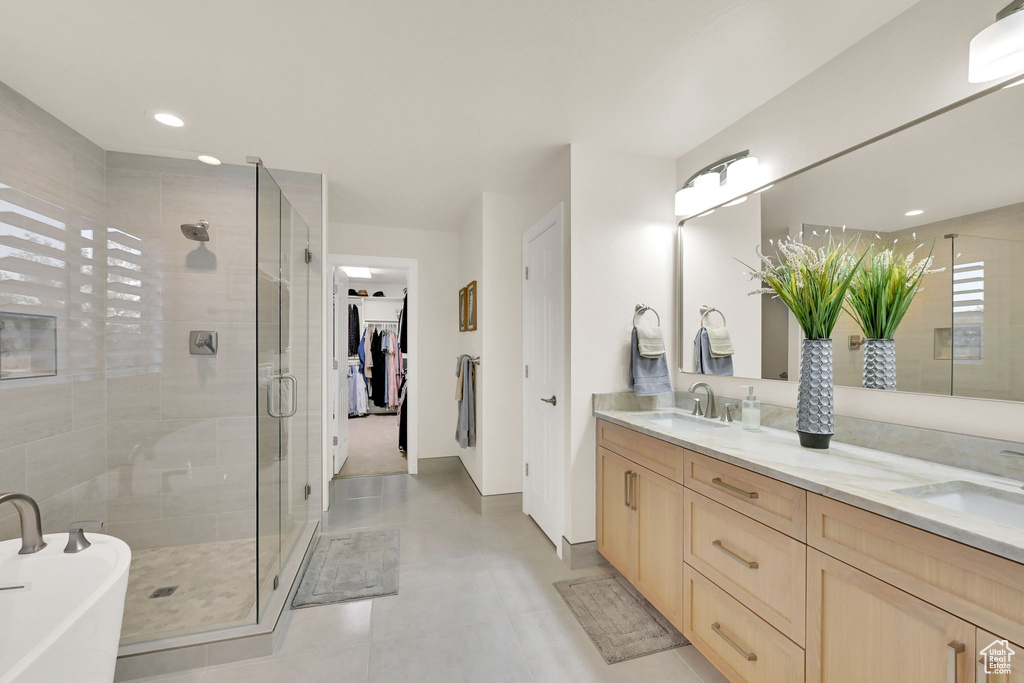 Bathroom with vanity and separate shower and tub