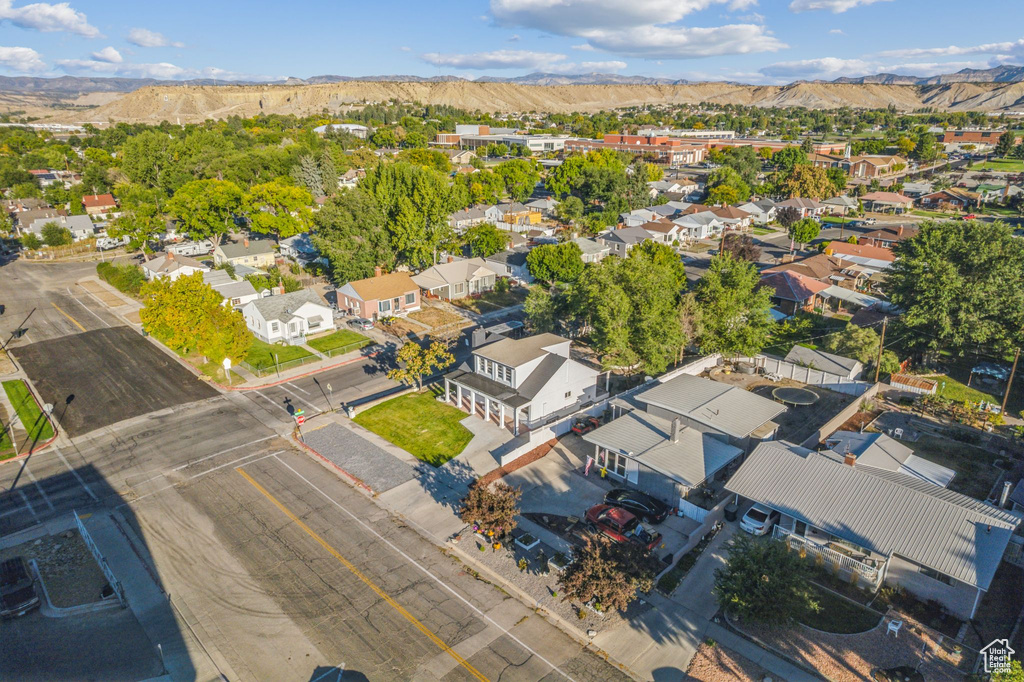 Birds eye view of property with a mountain view