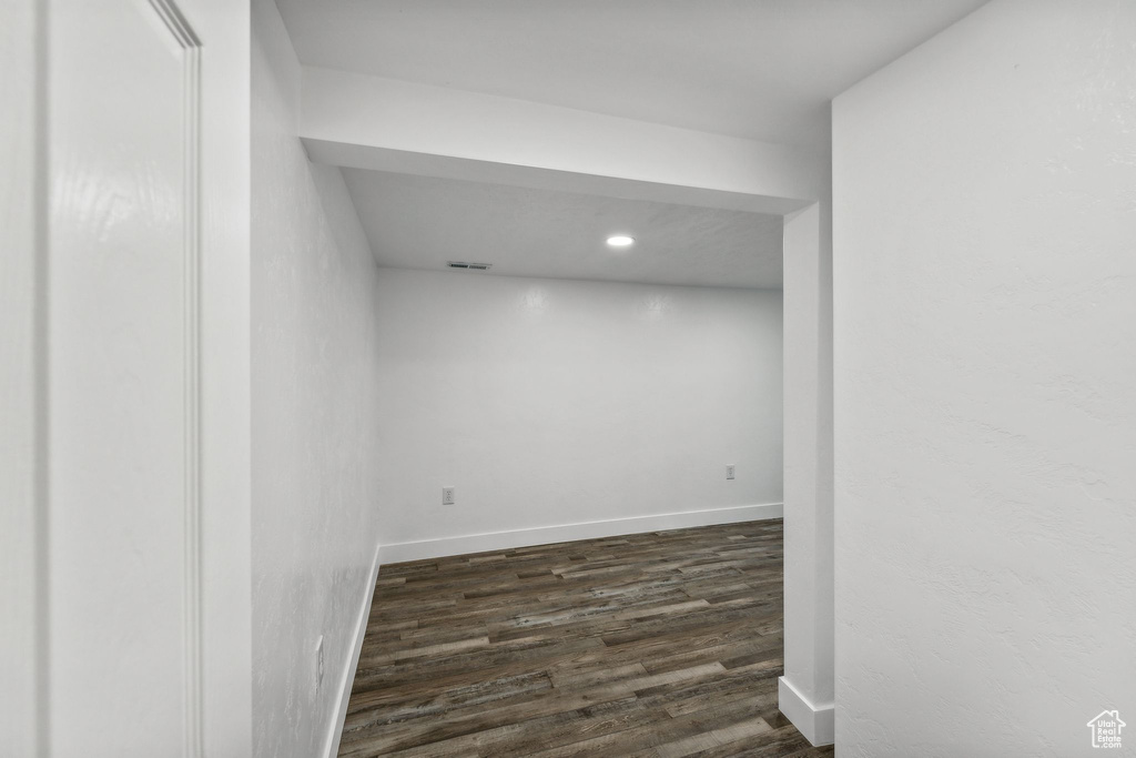 Basement featuring dark hardwood / wood-style floors