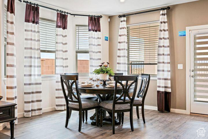 Dining area with wood-type flooring