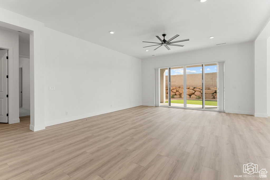 Spare room featuring light hardwood / wood-style floors and ceiling fan