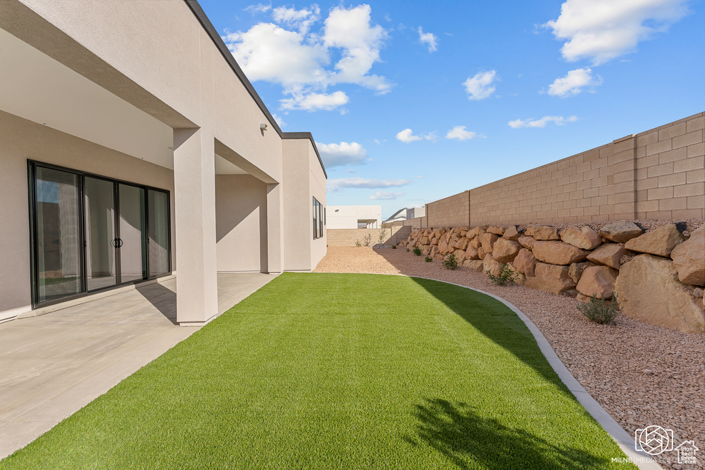 View of yard with a patio area