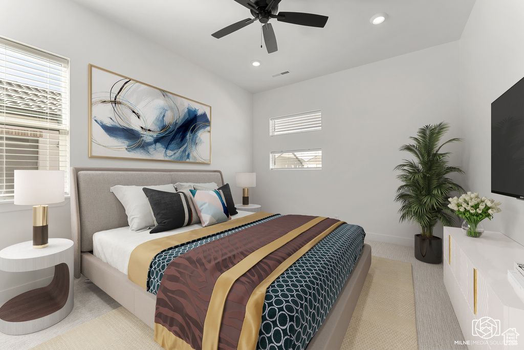 Bedroom featuring ceiling fan and light carpet