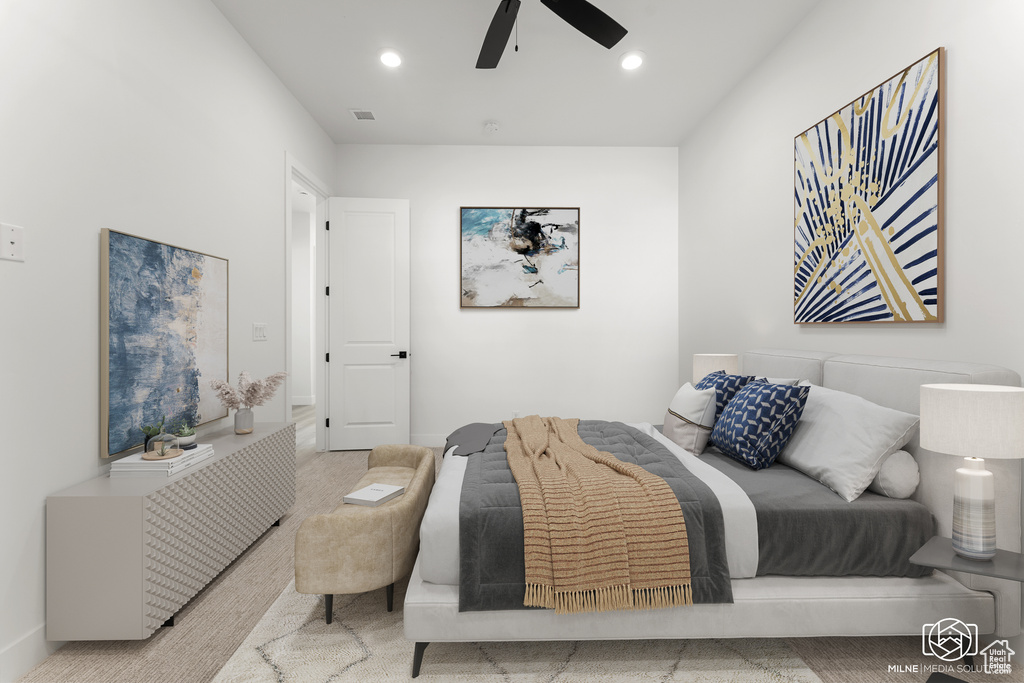 Bedroom with light colored carpet and ceiling fan