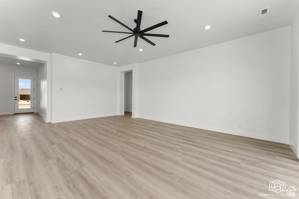 Spare room with light hardwood / wood-style floors and ceiling fan