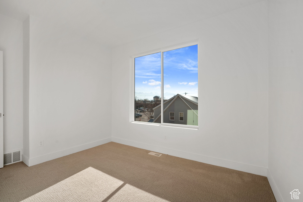 View of carpeted spare room