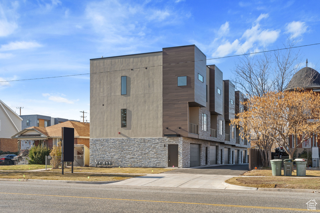 View of building exterior with a garage