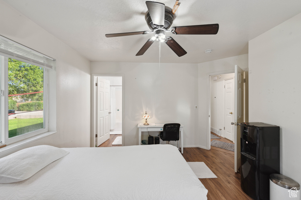 Bedroom featuring ceiling fan and hardwood / wood-style floors