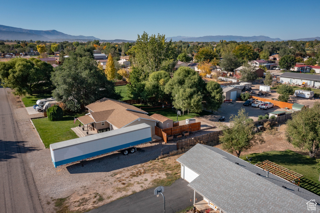 Birds eye view of property with a mountain view