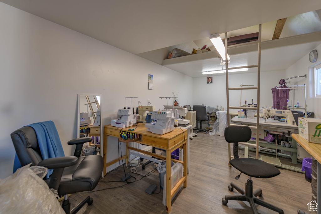 Office space with hardwood / wood-style floors