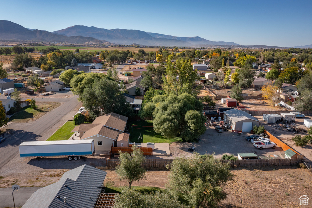 Birds eye view of property with a mountain view