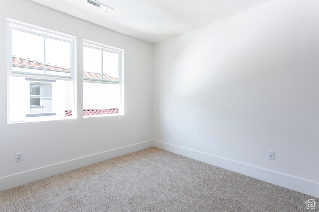 Unfurnished room with carpet floors