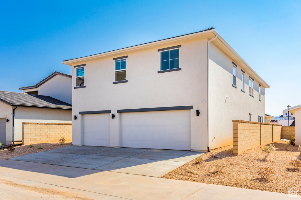 View of front of property featuring a garage