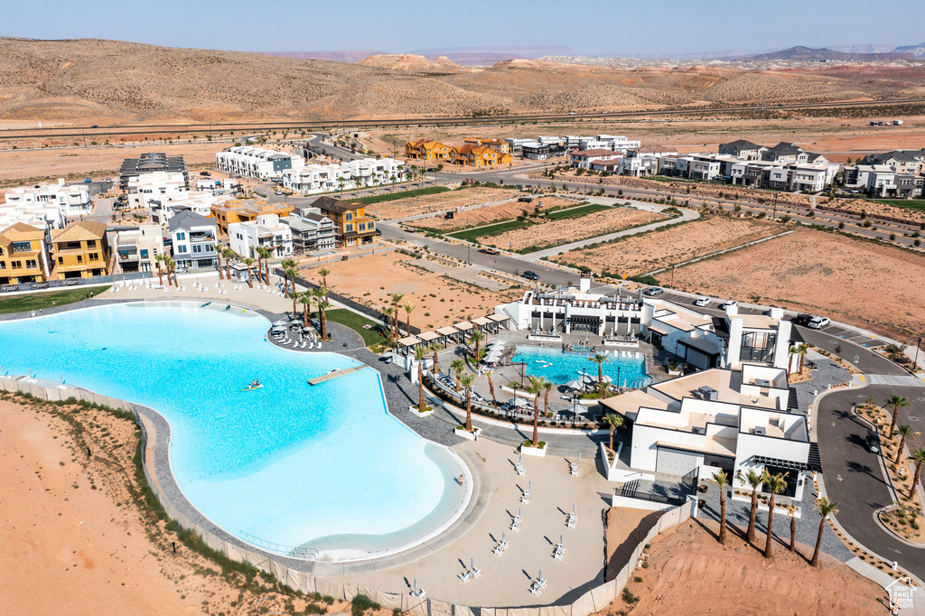 View of pool with a mountain view and a patio area