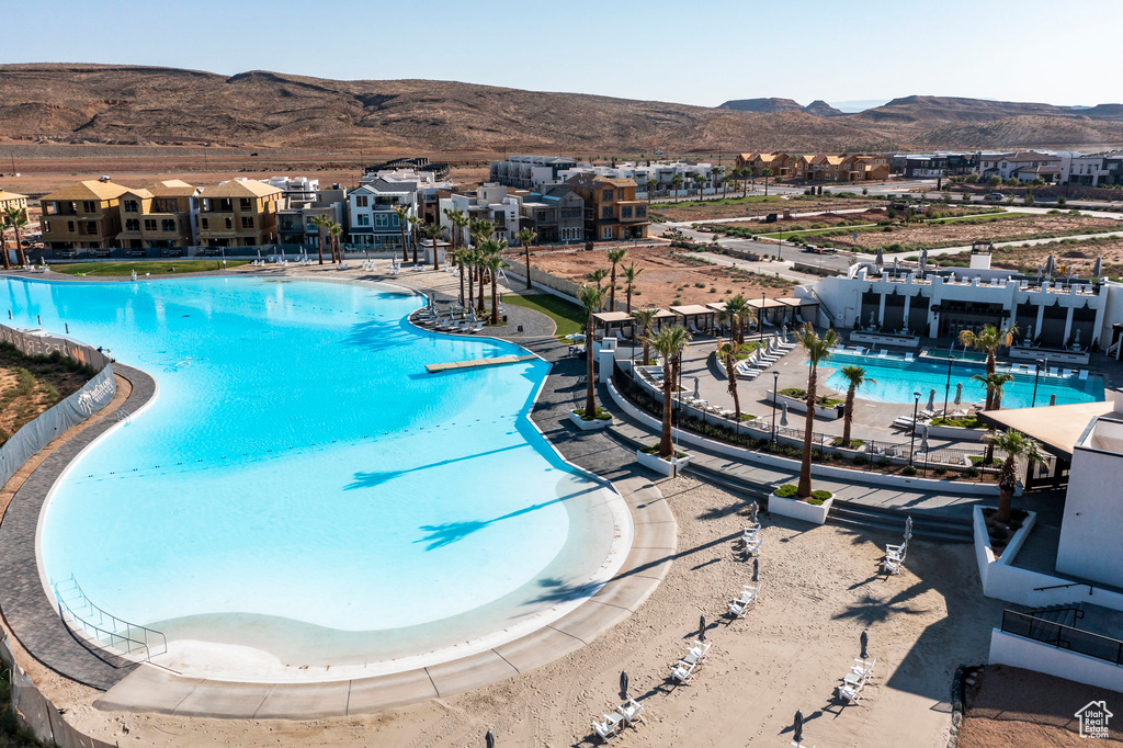 View of swimming pool featuring a mountain view and a patio area