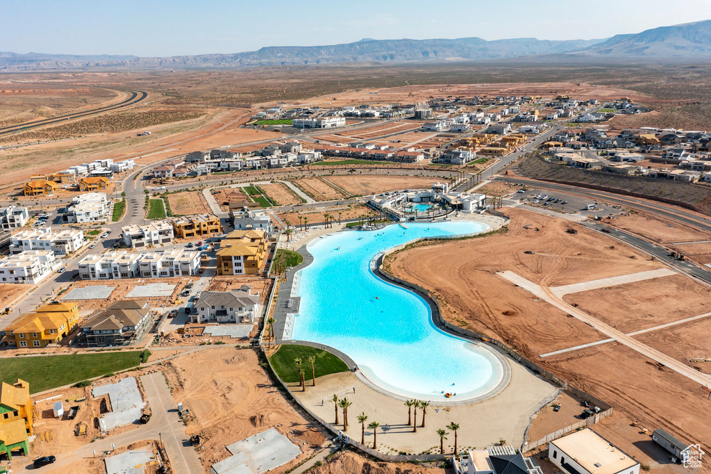 Birds eye view of property with a mountain view