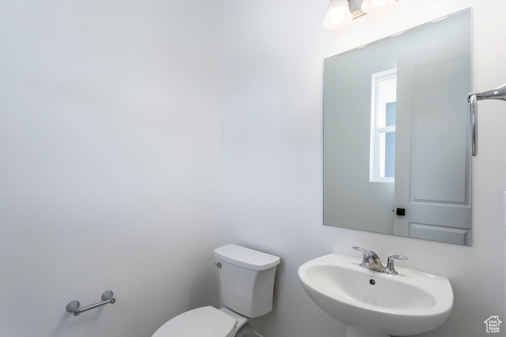 Bathroom with sink and toilet