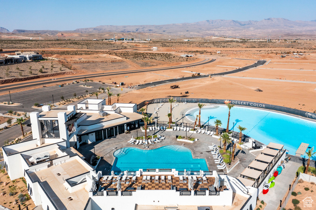 Birds eye view of property with a mountain view