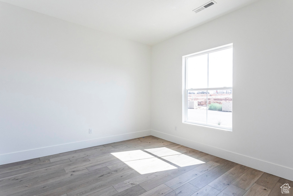 Unfurnished room with light wood-type flooring