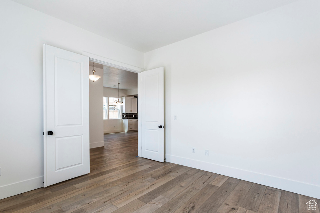 Unfurnished room featuring hardwood / wood-style floors