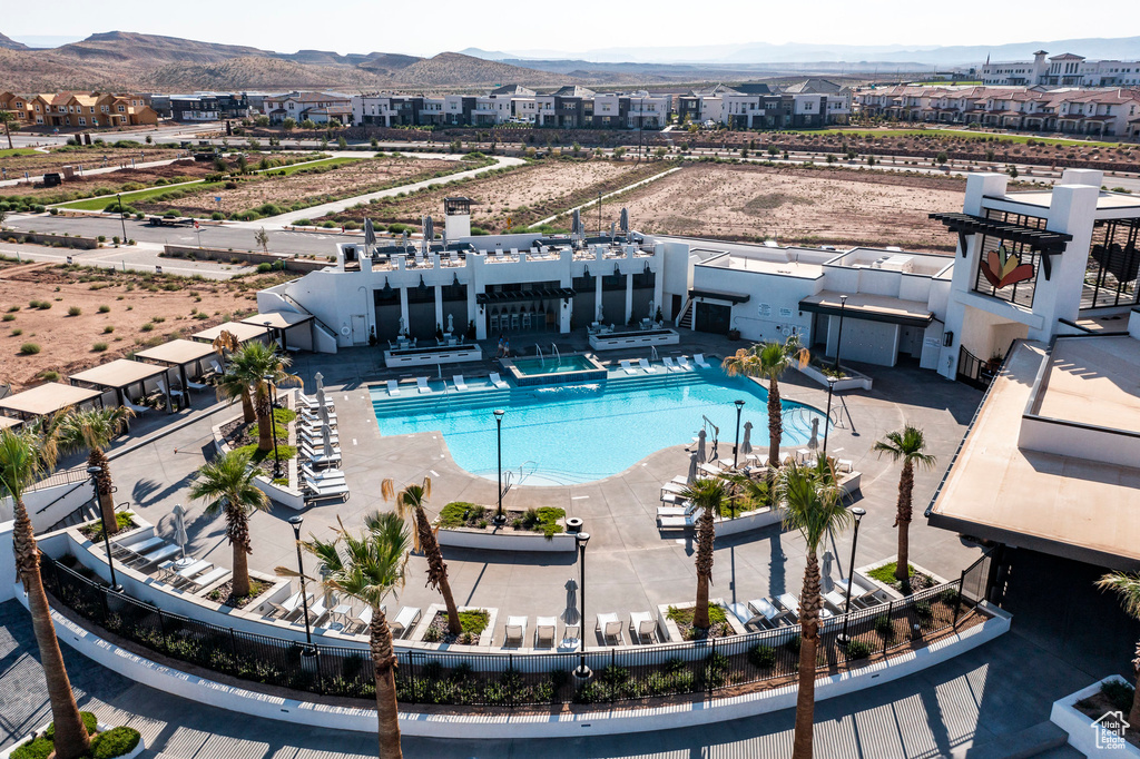 View of swimming pool featuring a patio and a mountain view