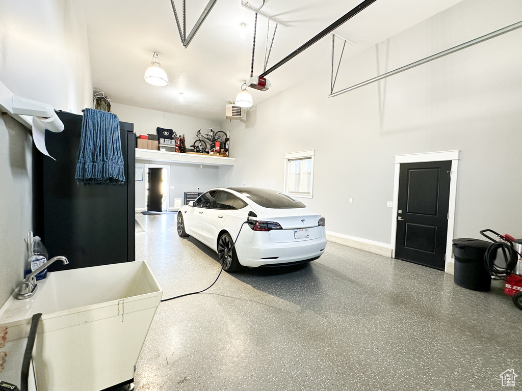 Garage with a garage door opener and sink