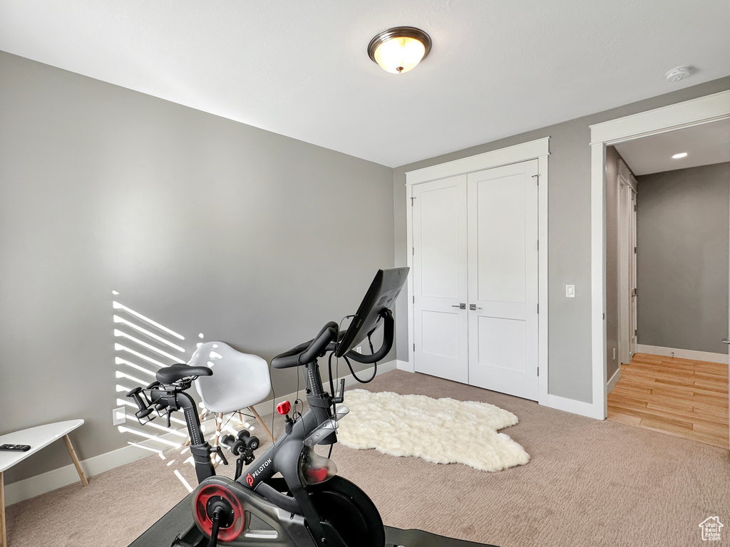 Exercise room with wood-type flooring